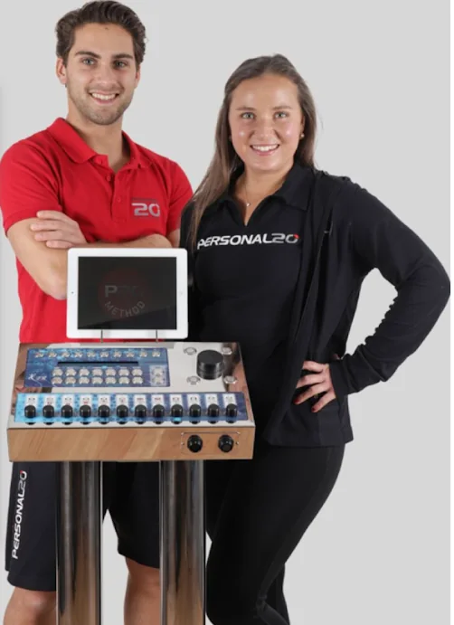 Two certified P20 trainers standing with the EMS control unit